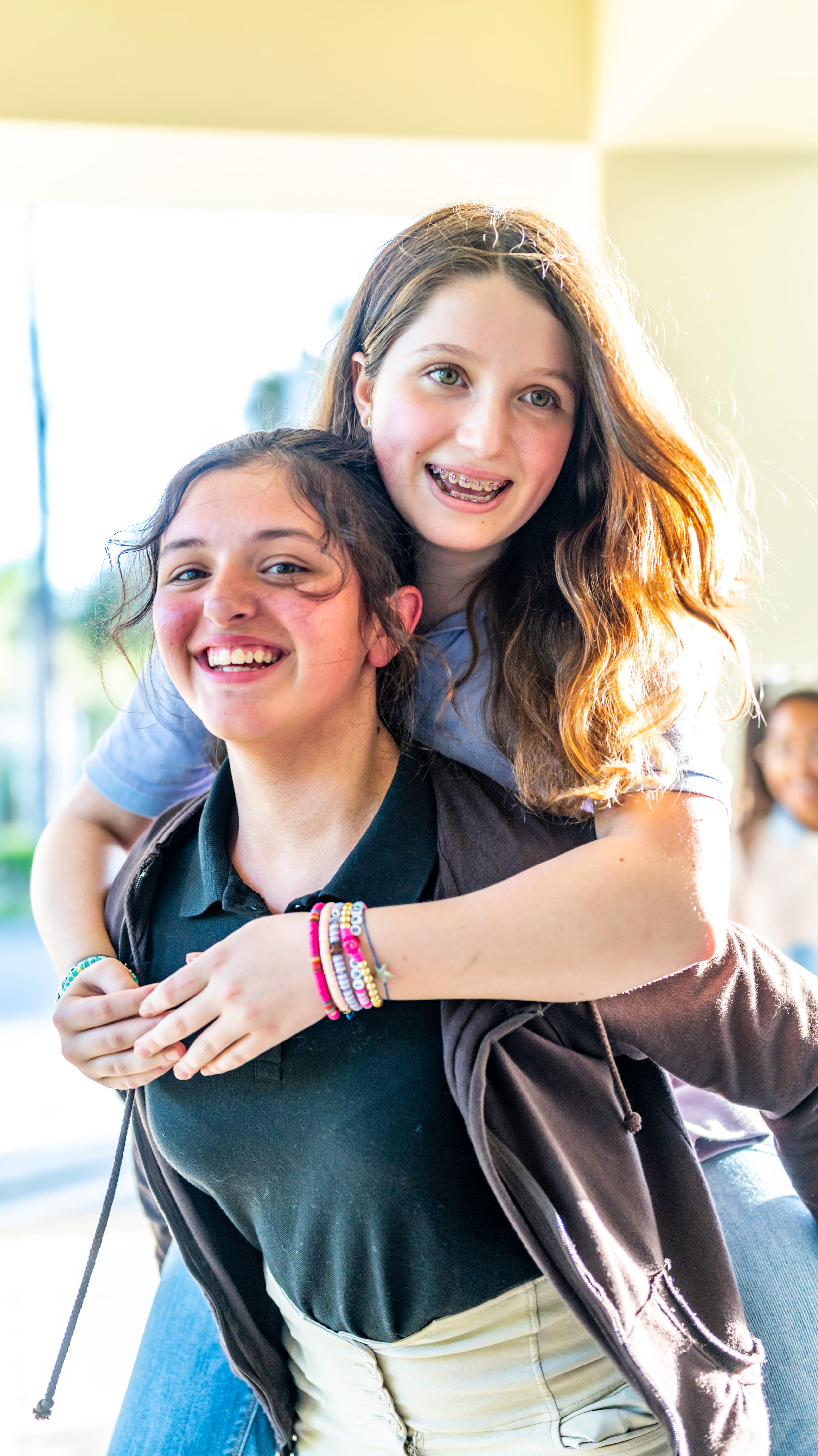 Orthodontic patient smiling after treatment, representing the power of patient referral marketing